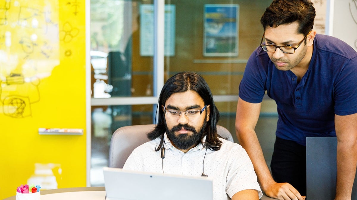 ASU students Rakshith Subramanyam (left) and Nikhil Agarwal (right) work on the web app. Photo credit: Andy DeLisle