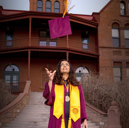Pooja graduation photo at ASU outside of the Old Main building